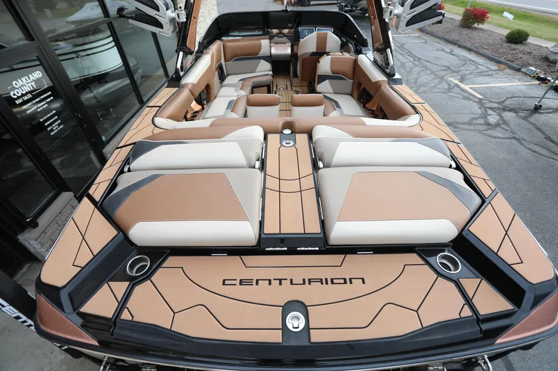 Slide: The Image of 2021 Centurion Ri245 boat interior with luxurious tan and cream seating. - 12