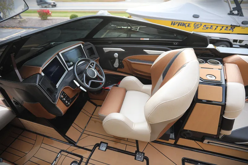 Slide: The Image of Interior of 2021 Centurion Ri245 boat with modern dashboard and luxurious seating. - 16