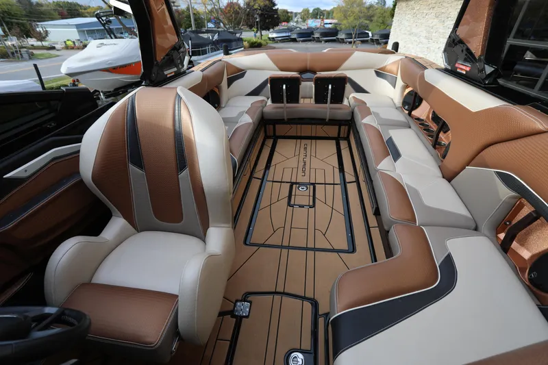 Slide: The Image of Luxurious interior of a 2021 Centurion Ri245 boat with brown and beige seating. - 4