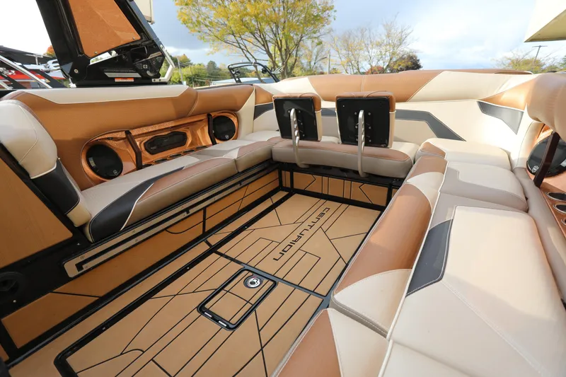 Slide: The Image of Luxurious interior of 2021 Centurion Ri245 boat with tan and beige seating. - 6