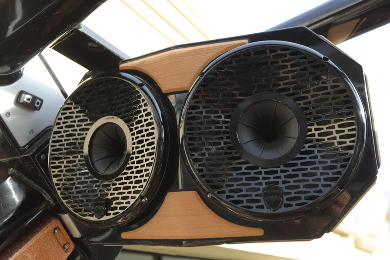 Slide: The Image of 2021 Centurion Ri245 boat speakers with sleek black and wood design. - 8