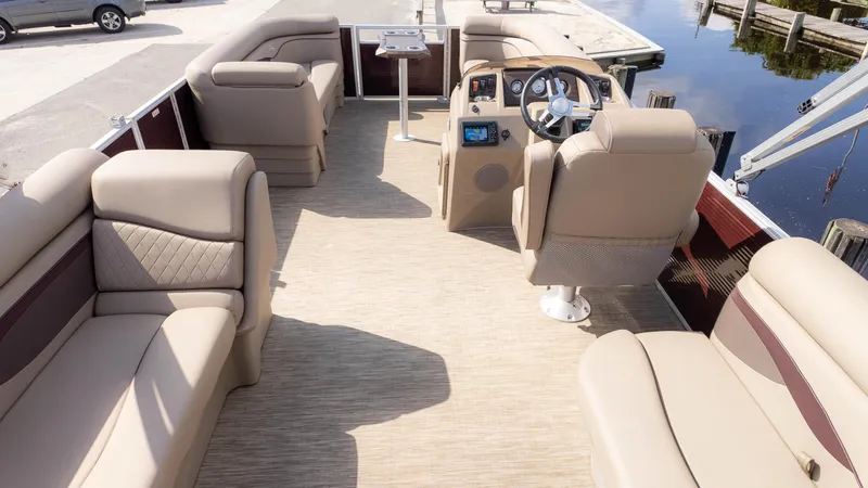 Slide: The Image of 2024 Bennington 20SSR pontoon boat interior with luxurious seating and modern helm. - 7