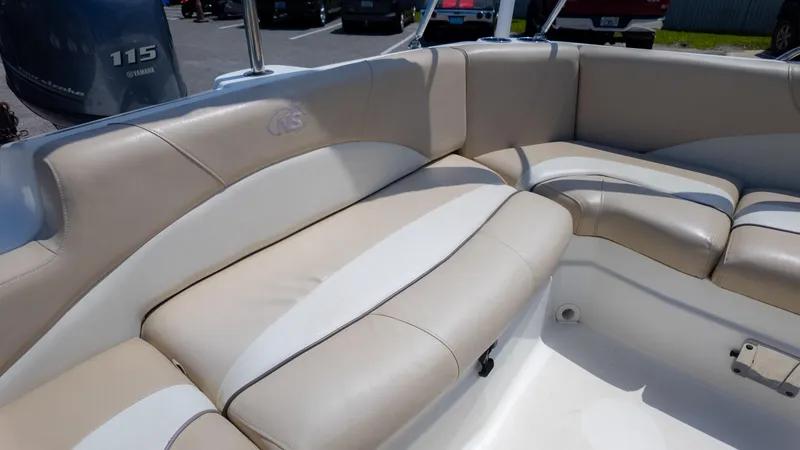Slide: The Image of 2017 NauticStar 203 SC boat interior with beige seating and Yamaha 115 engine. - 14