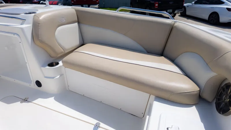 Slide: The Image of 2017 NauticStar 203 SC boat interior with beige and white seating. - 20
