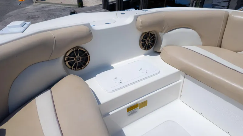 Slide: The Image of 2017 NauticStar 203 SC boat interior with beige seating and built-in speakers. - 22