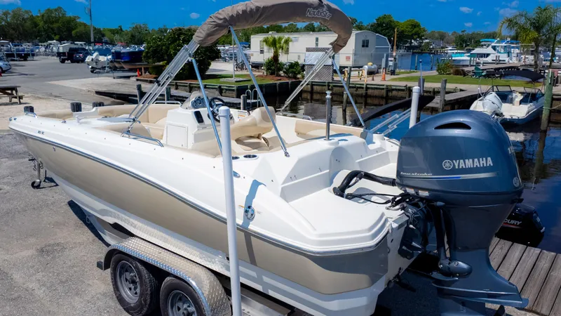 Slide: The Image of 2017 NauticStar 203 SC boat with Yamaha engine on trailer at marina. - 6