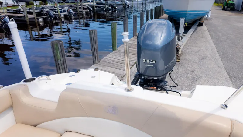 Slide: The Image of 2017 NauticStar 203 SC boat with Yamaha 115 engine docked at marina. - 8