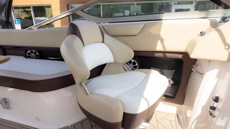 Slide: The Image of 2015 Regal 2500 boat interior with beige and white seating. - 17
