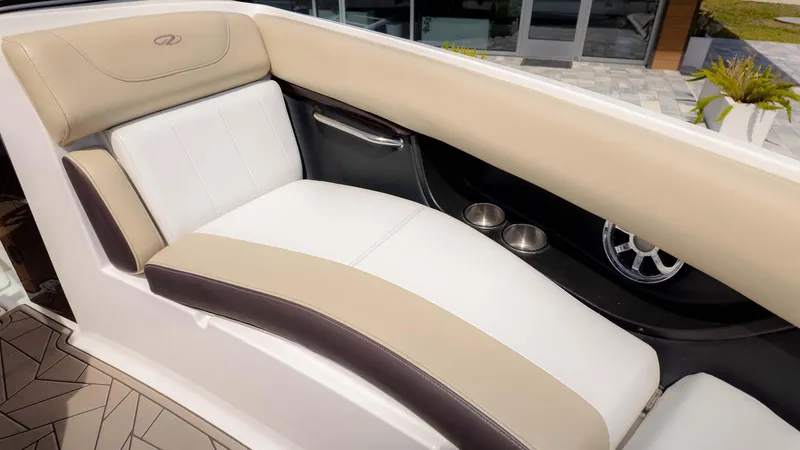 Slide: The Image of Luxurious seating in a 2015 Regal 2500 boat, featuring beige and white upholstery. - 21