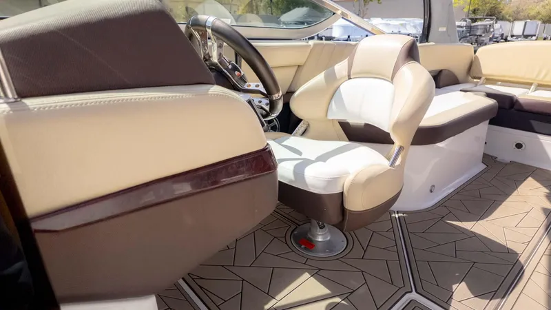 Slide: The Image of Interior of a 2015 Regal 2500 boat with beige and brown seating. - 26