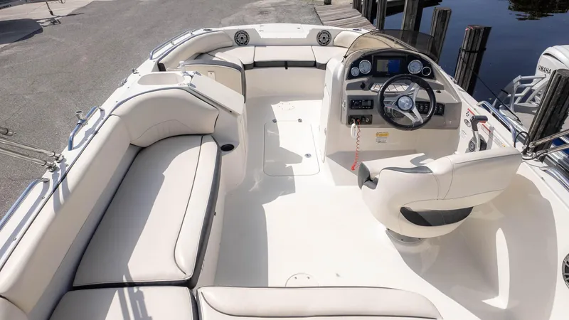 Slide: The Image of 2021 Stingray 192SC boat interior with white seating and modern dashboard. - 5