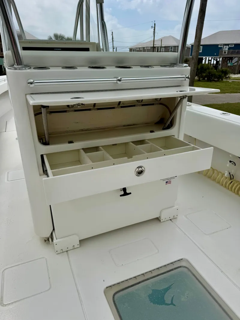 Slide: The Image of 2023 Contender 35ST boat with open storage compartments on deck. - 11