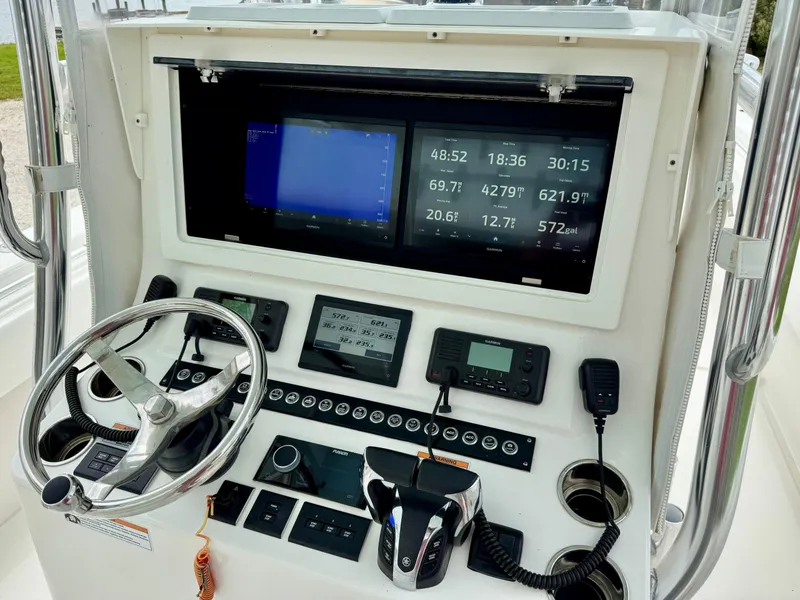 Slide: The Image of 2023 Contender 35ST boat dashboard with advanced navigation and control systems. - 20