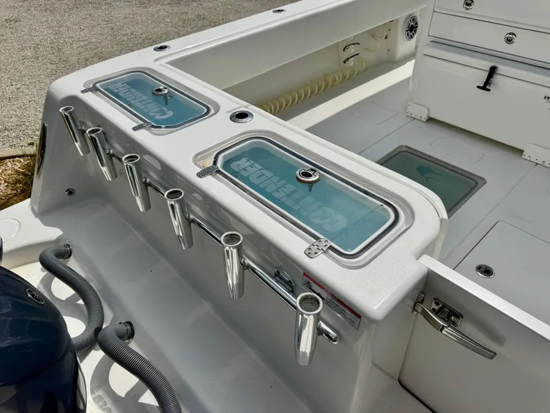 Slide: The Image of 2023 Contender 35ST boat deck with rod holders and storage compartments. - 30