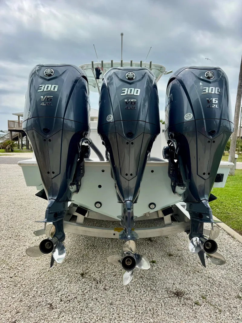 Slide: The Image of 2023 Contender 35ST boat with triple Yamaha 300 outboard engines. - 4