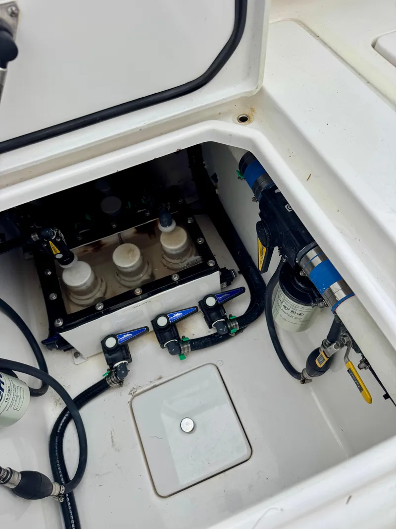 Slide: The Image of 2023 Contender 35ST boat compartment with wiring and filtration system. - 8
