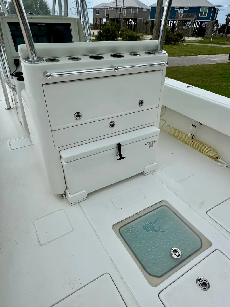 Slide: The Image of 2023 Contender 35ST boat deck with storage compartments and livewell. - 9