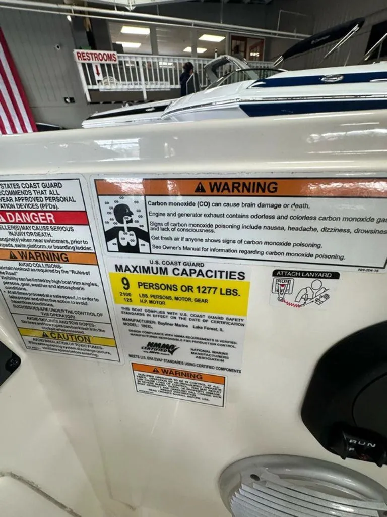 Slide: The Image of 2017 Bayliner Element 18 warning labels and capacity limits, including carbon monoxide safety information. - 11