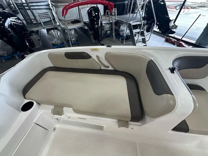 Slide: The Image of 2017 Bayliner Element 18 boat interior with beige and gray seating. - 13