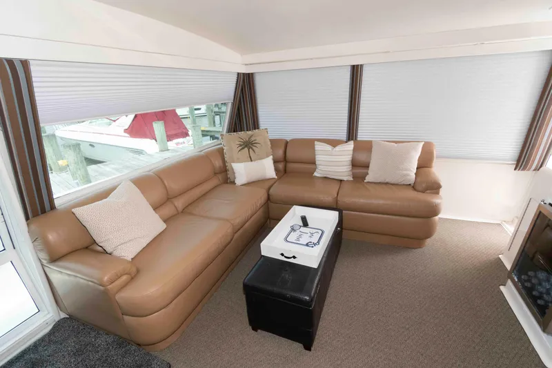 Slide: The Image of Luxurious interior of 1999 Viking 60 Cockpit Motor Yacht with leather seating and modern decor. - 10