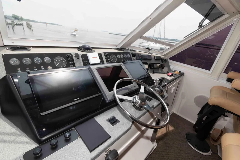 Slide: The Image of Helm of 1999 Viking 60 Cockpit Motor Yacht with modern navigation equipment. - 19