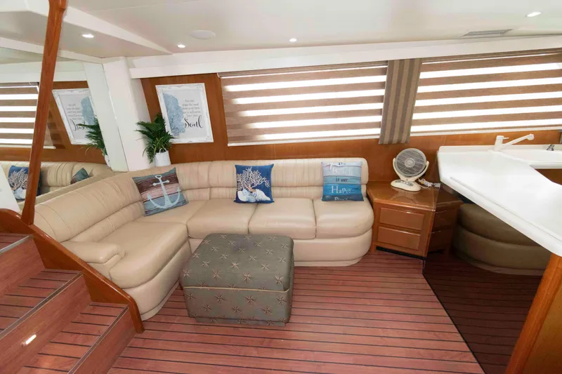 Slide: The Image of Luxurious interior of 1999 Viking 60 Cockpit Motor Yacht with plush seating and nautical decor. - 21