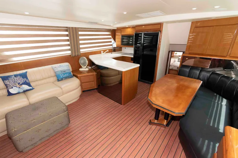 Slide: The Image of Luxurious interior of 1999 Viking 60 Cockpit Motor Yacht with modern furnishings. - 24