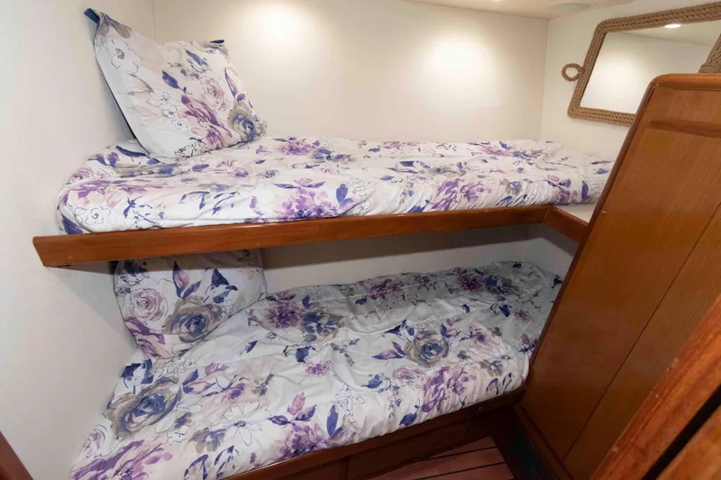 Slide: The Image of Bunk beds with floral bedding in 1999 Viking 60 Cockpit Motor Yacht cabin. - 36
