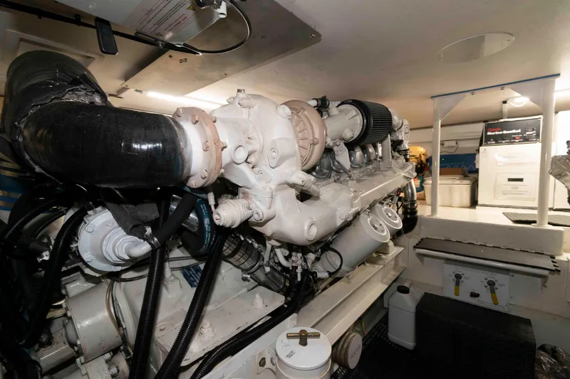 Slide: The Image of Engine room of 1999 Viking 60 Cockpit Motor Yacht, showcasing detailed machinery and components. - 41