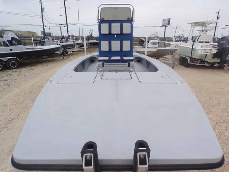 Slide: The Image of 2025 Freedom Warrior 23 boat displayed in a dealership lot. - 13