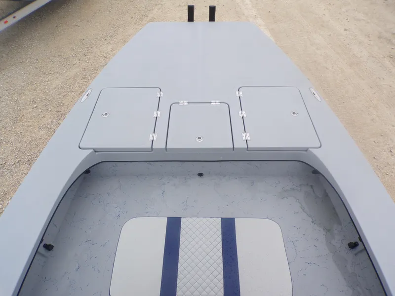 Slide: The Image of 2025 Freedom Warrior 23 boat deck with storage compartments and cushioned seating. - 16