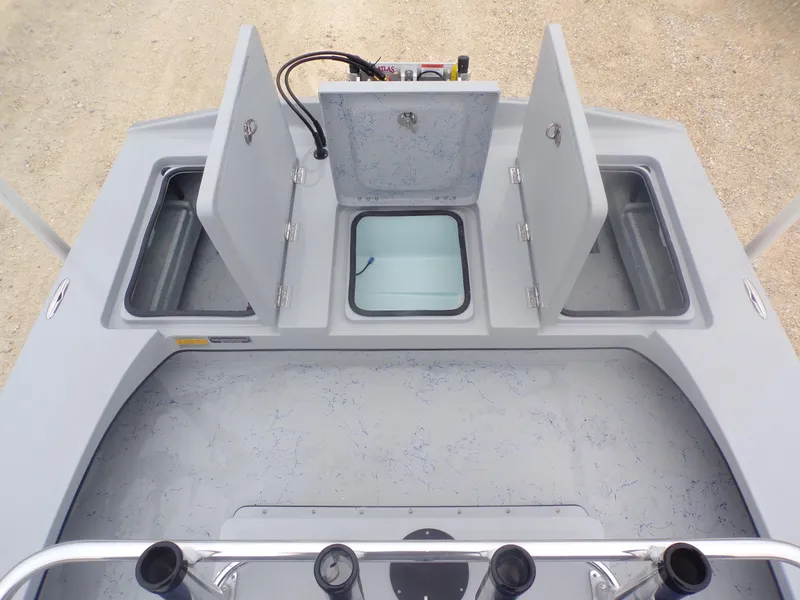 Slide: The Image of 2025 Freedom Warrior 23 boat deck with open storage compartments. - 30