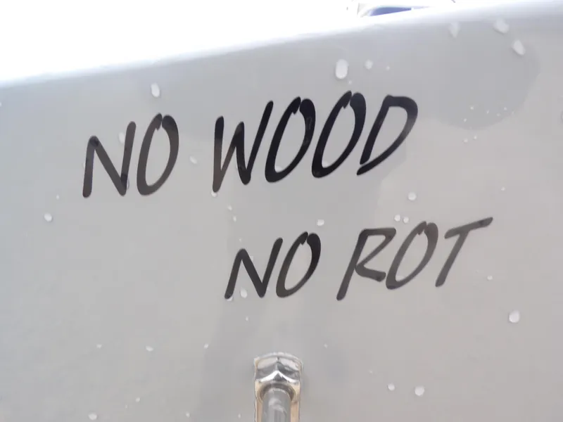 Slide: The Image of Freedom Warrior 23 boat with 'No Wood No Rot' text, 2025 model. - 32