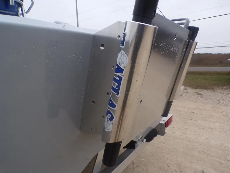 Slide: The Image of Rear view of a 2025 Freedom Warrior 23 boat with metal trim and logo. - 33