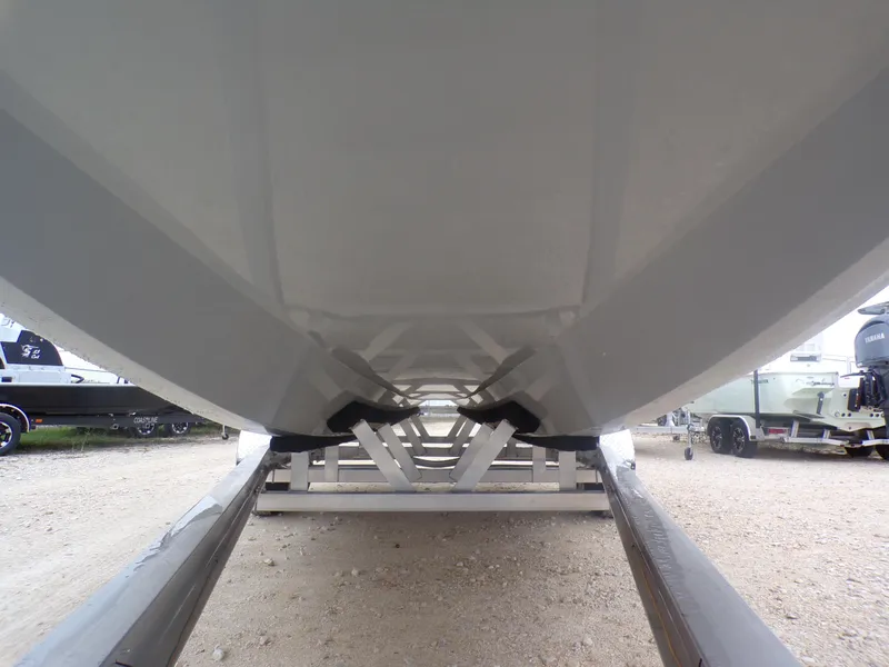 Slide: The Image of Underneath view of a 2025 Freedom Warrior 23 boat on a trailer. - 6