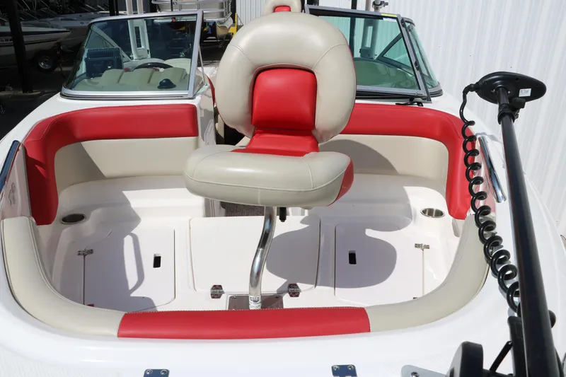 Slide: The Image of 2014 Chaparral 21 H2O Ski & Fish boat interior with red and beige seating. - 14