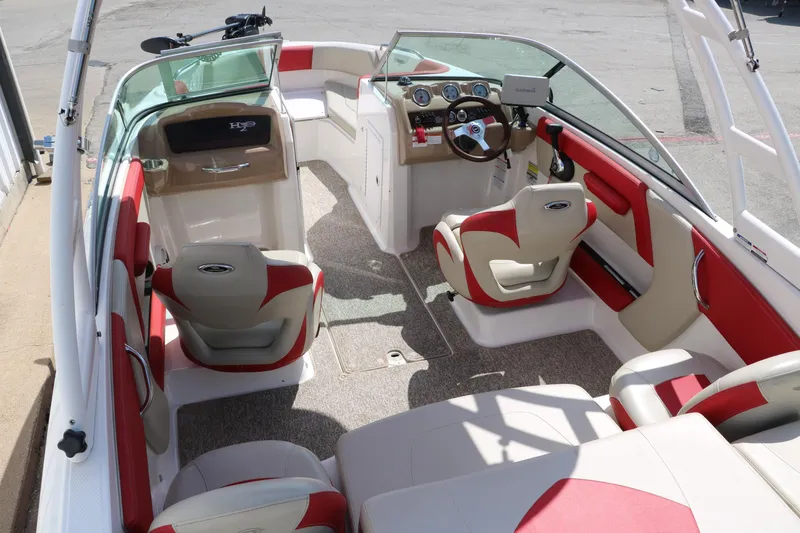 Slide: The Image of 2014 Chaparral 21 H2O Ski & Fish boat interior with red and beige seating. - 17