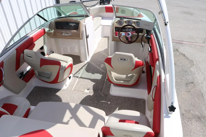 Slide: The Image of 2014 Chaparral 21 H2O Ski & Fish boat interior with red and beige seating. - 20
