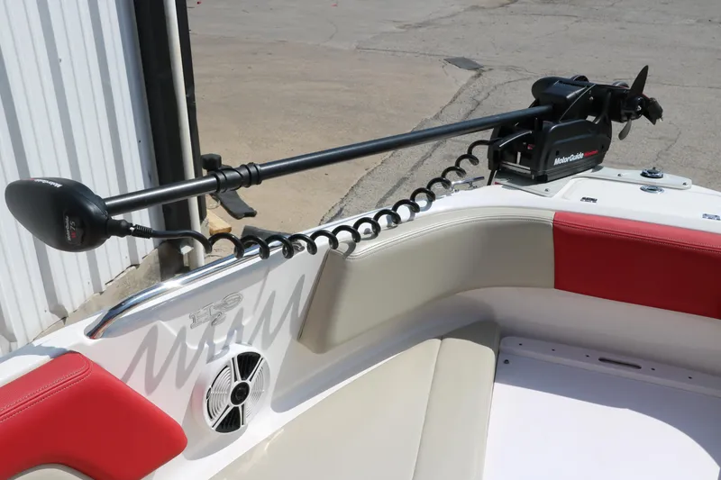 Slide: The Image of 2014 Chaparral 21 H2O Ski & Fish boat with trolling motor and red-accented seating. - 22