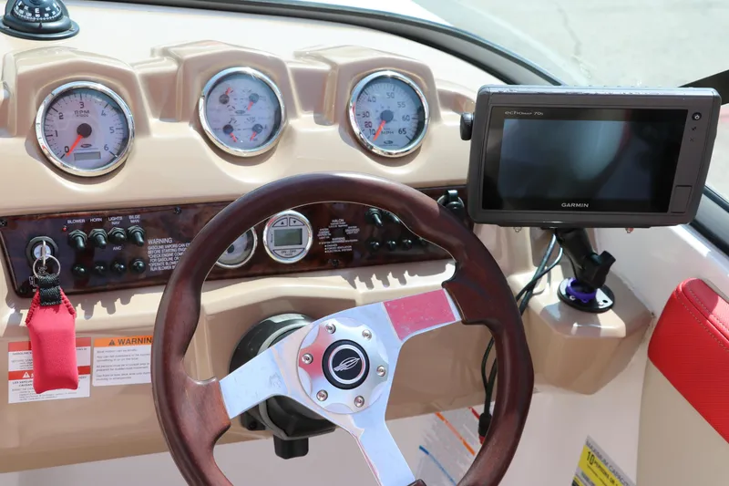 Slide: The Image of Dashboard of 2014 Chaparral 21 H2O Ski & Fish boat with steering wheel and gauges. - 27