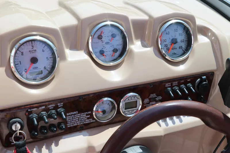 Slide: The Image of Dashboard of 2014 Chaparral 21 H2O Ski & Fish boat with gauges and controls. - 29