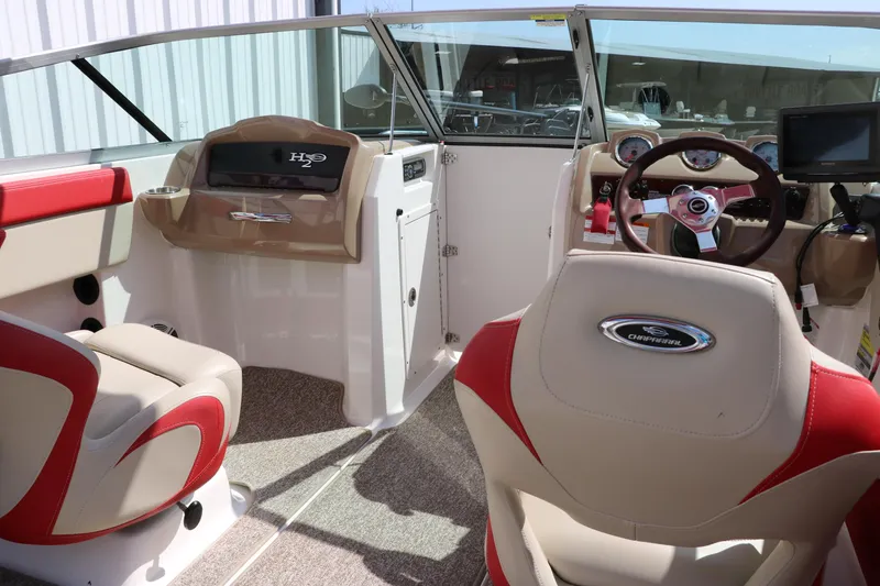 Slide: The Image of 2014 Chaparral 21 H2O Ski & Fish boat interior with red and beige seating. - 30