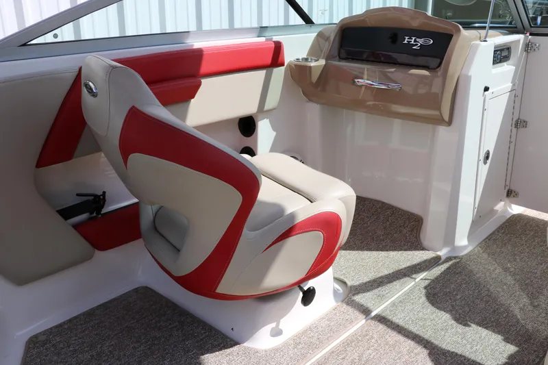 Slide: The Image of 2014 Chaparral 21 H2O Ski & Fish boat interior with red and beige seating. - 31