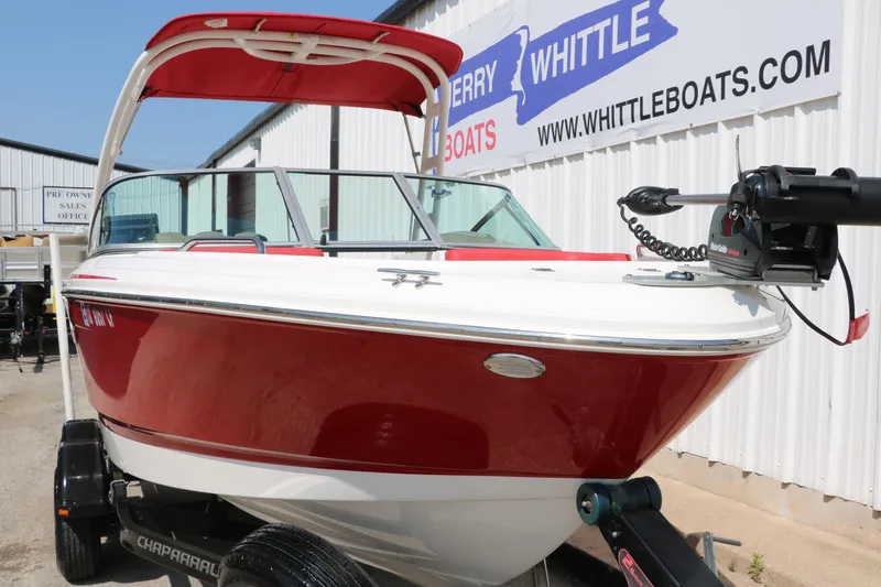 Slide: The Image of 2014 Chaparral 21 H2O Ski & Fish boat, red and white, on trailer at dealership. - 8