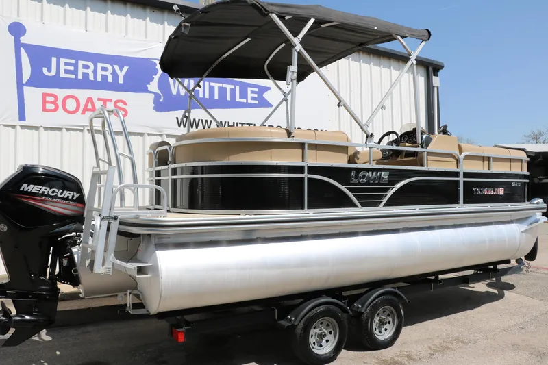 Slide: The Image of 2019 Lowe SS210 pontoon boat with Mercury engine at Jerry Whittle Boats dealership. - 2