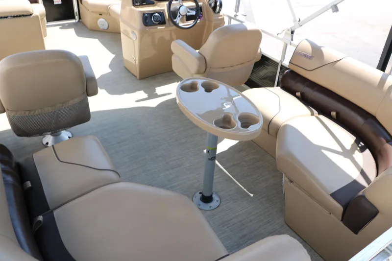 Slide: The Image of Interior of 2019 Lowe SS210 pontoon boat with beige seating and cup holders. - 22