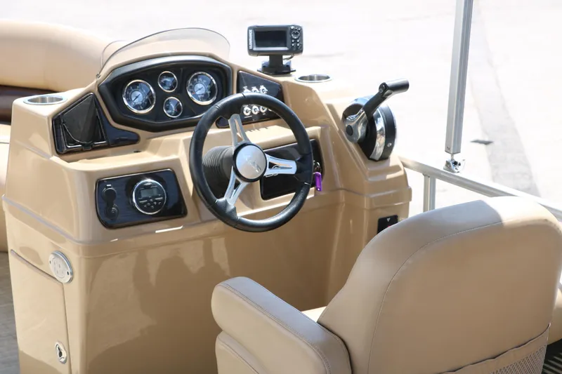 Slide: The Image of Steering console of 2019 Lowe SS210 boat with gauges and controls. - 23