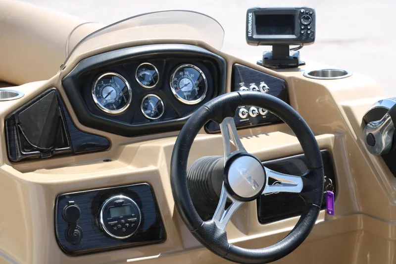 Slide: The Image of Steering console of 2019 Lowe SS210 boat with gauges and navigation system. - 24
