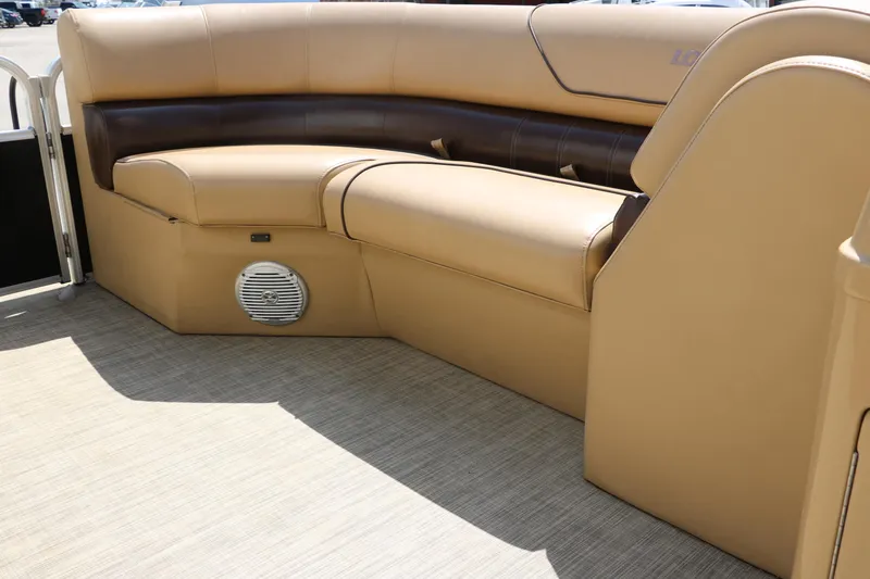 Slide: The Image of 2019 Lowe SS210 boat interior with tan seating and speaker. - 27