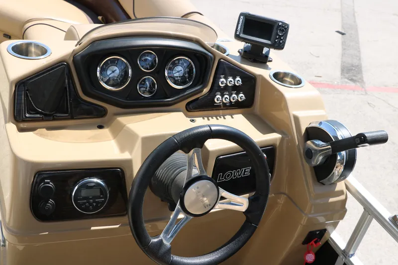 Slide: The Image of 2019 Lowe SS210 boat dashboard with steering wheel and control panel. - 29